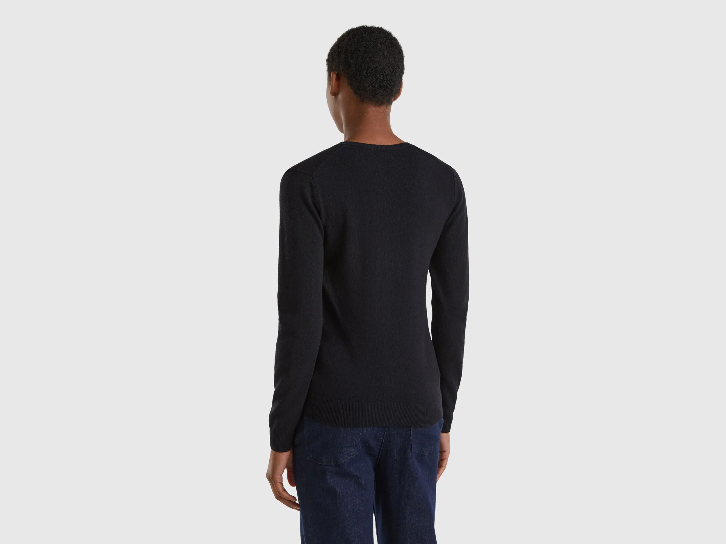 Black V-neck sweater in pure Merino wool - Black | Benetton