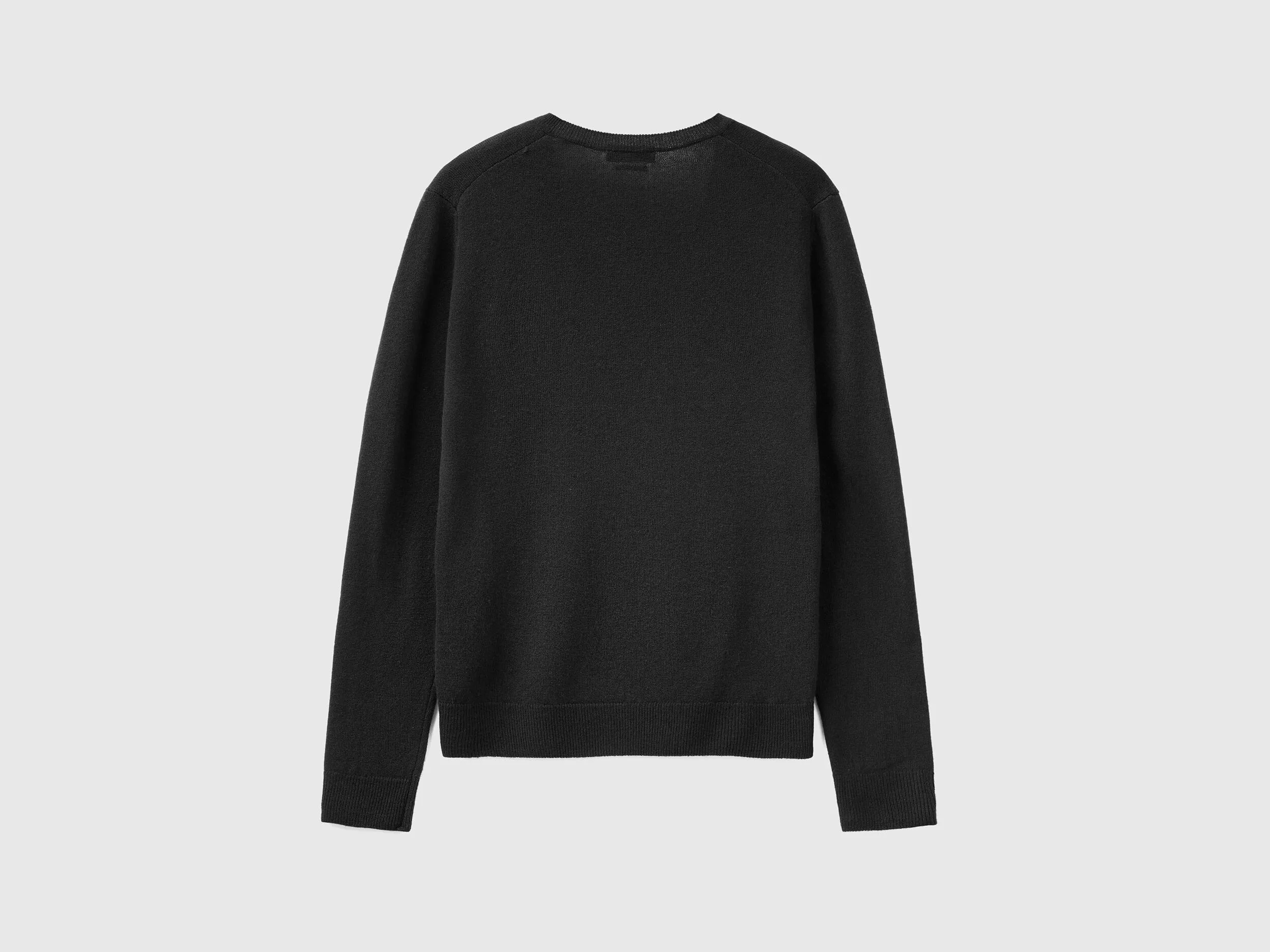 Black V-neck sweater in pure Merino wool - Black | Benetton